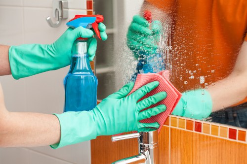 Trained carpet cleaner using protective equipment during a cleaning job