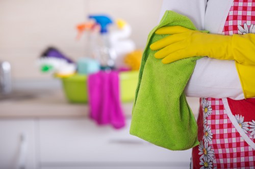 Cleaner in Uxbridge maintaining a tidy business workspace